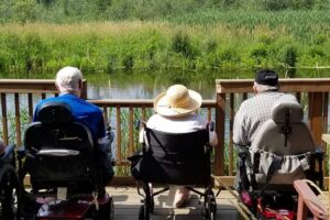 Bethany Home residents relaxing in the sun by Crystal River.