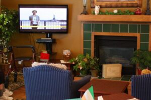 Bethany Home's residents at The Pines watching television in the community area.